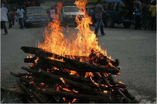 haiti-fire Haiti's pre-Carnival Celebration, two days before the quake. A chicken burns in the fire. (photo E. Parker)